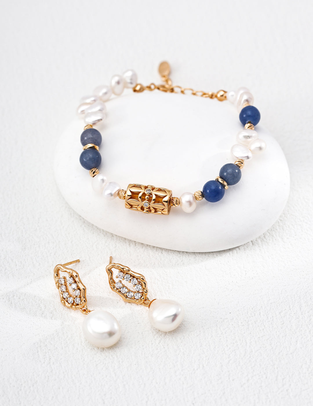A symbol of luck, the four-leaf clover is paired with natural pearls and aventurine jade